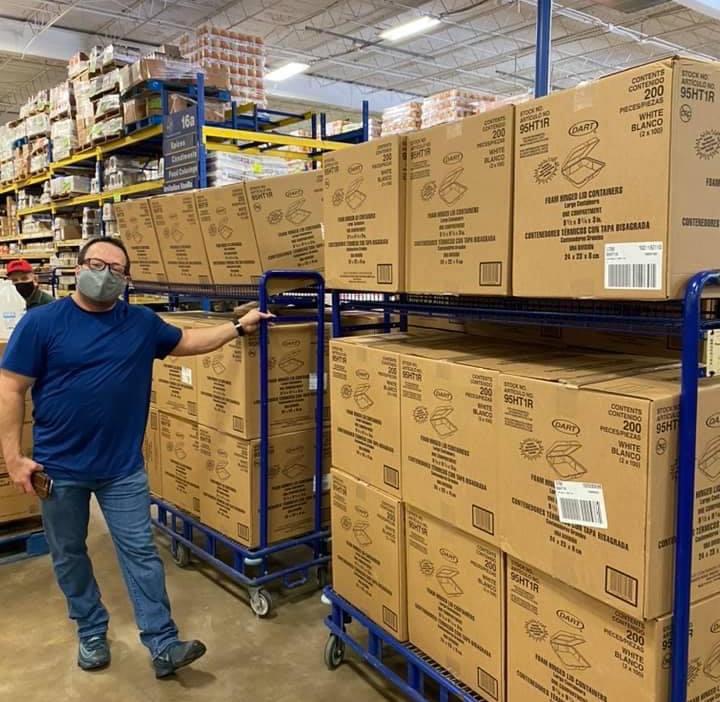 John Kalvaitis with clamshell containers to be used for Operation Turkey