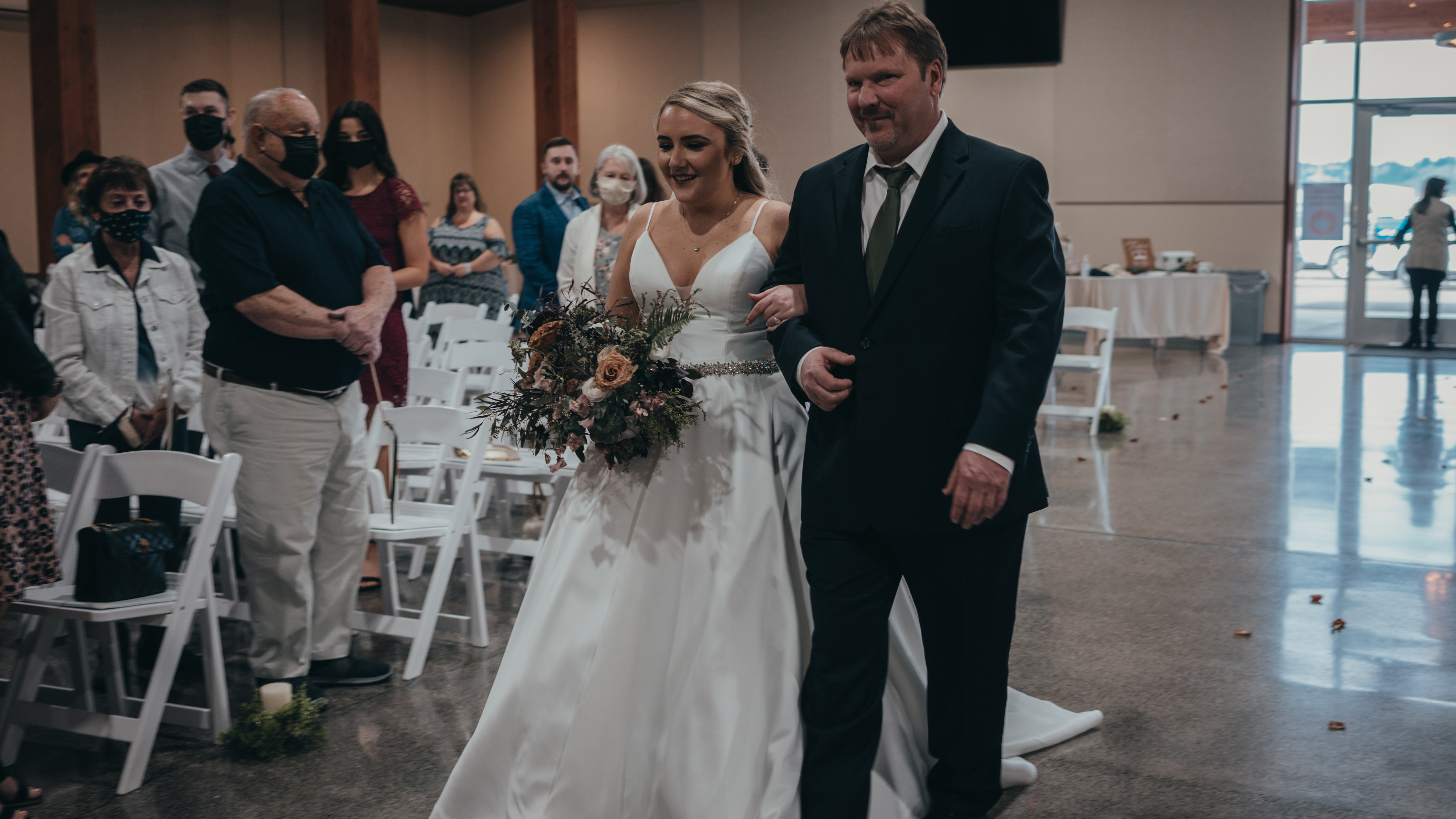 David and Breanna walk down the aisle