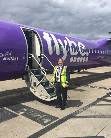 James in front of his plane