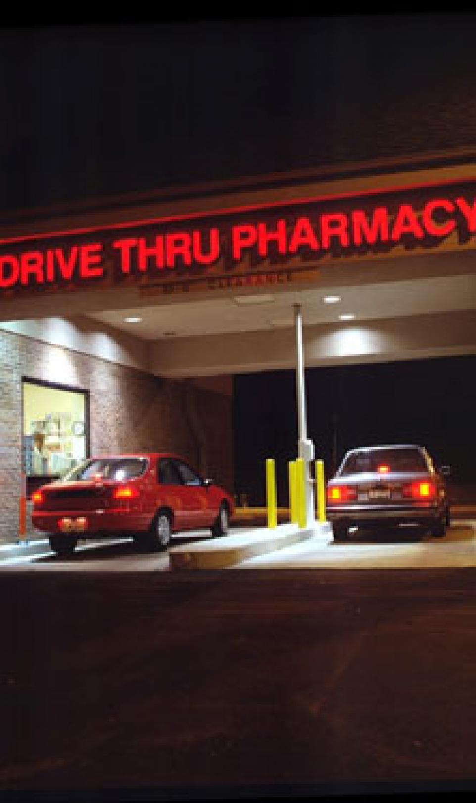 Outside view of a Walgreens drugstore with a drive-thru pharmacy