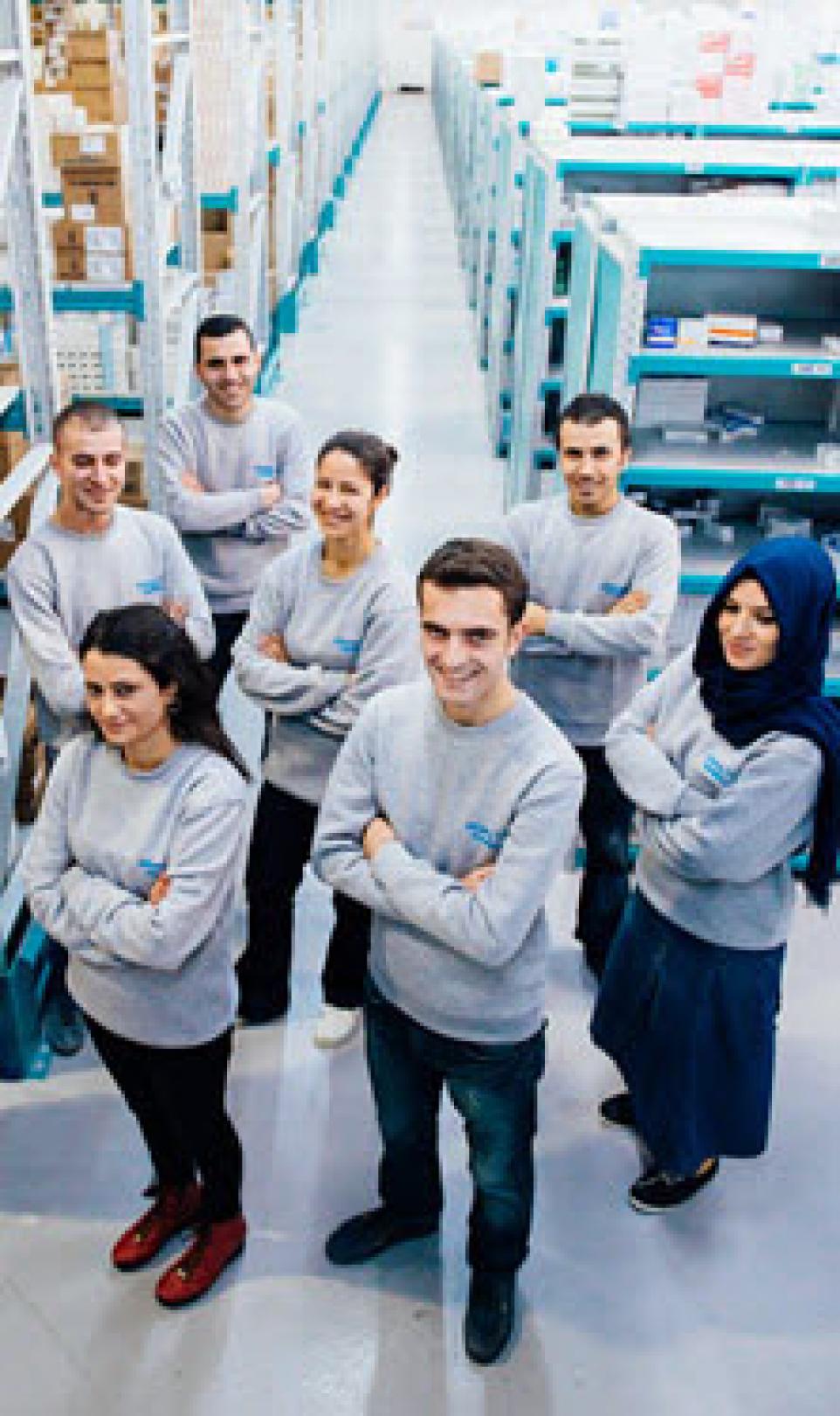  Alliance Healthcare employees pose for a photograph in a warehouse in Turkey