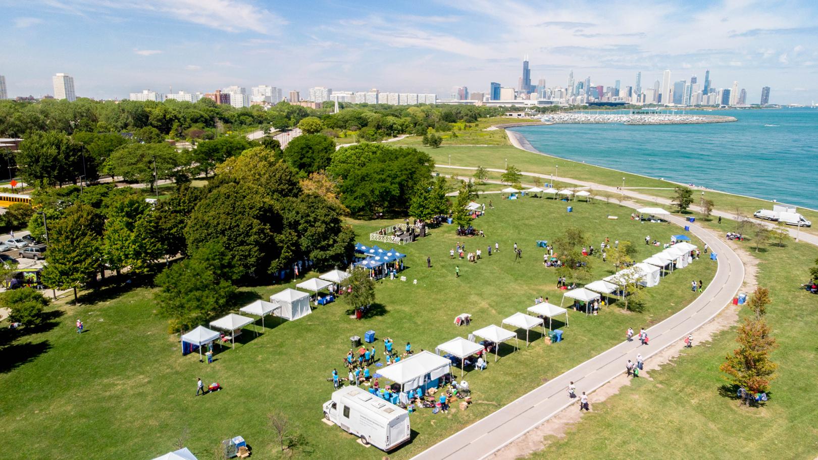 Drone view of summer time marquees at the Ladies First Health event