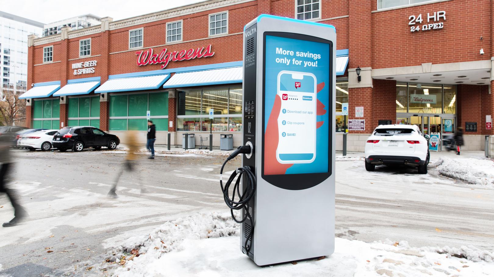 Electric vehicle charging point outside of a Walgreens drugstore.