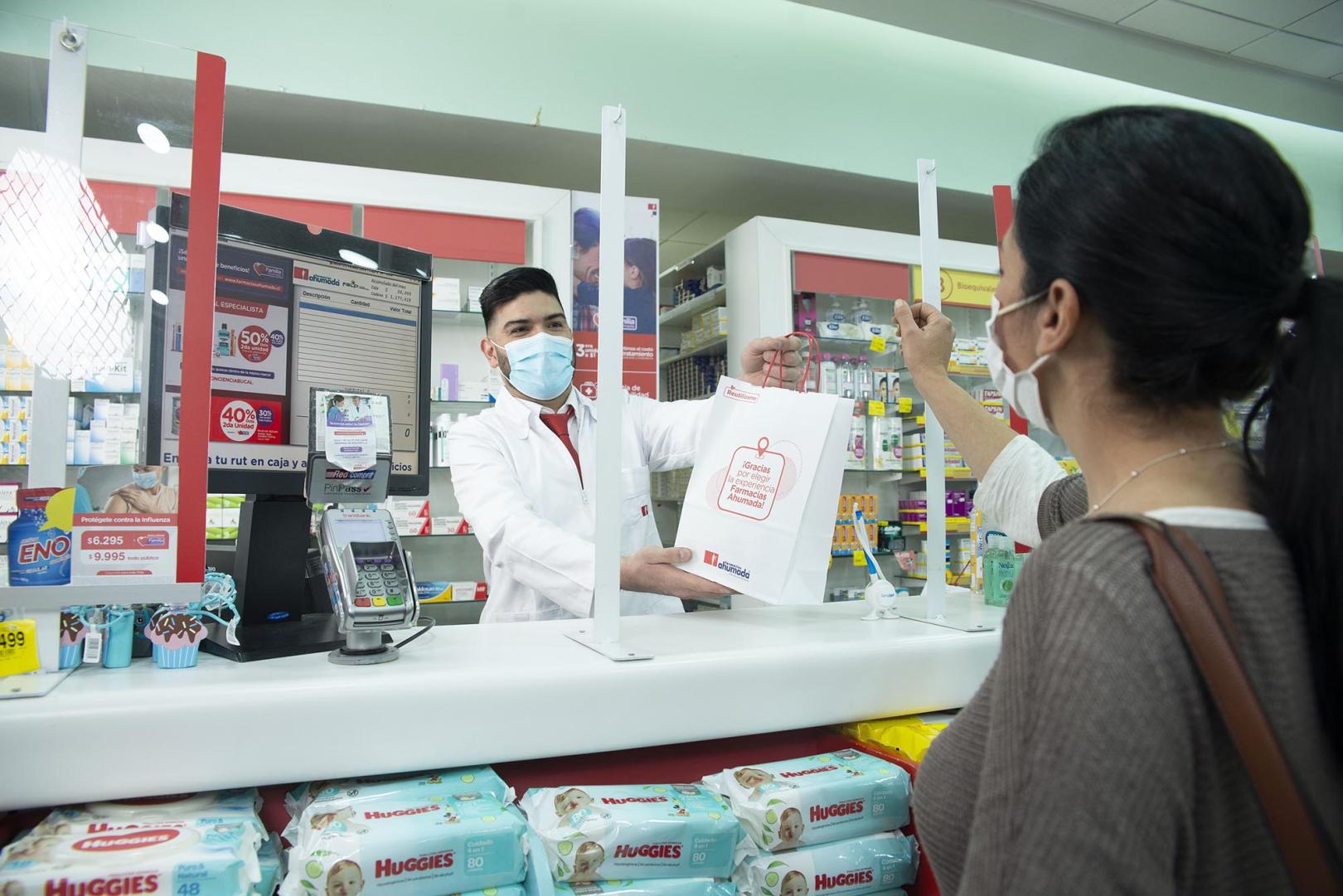 Farmacias Ahumada team member in Chile serving a customer