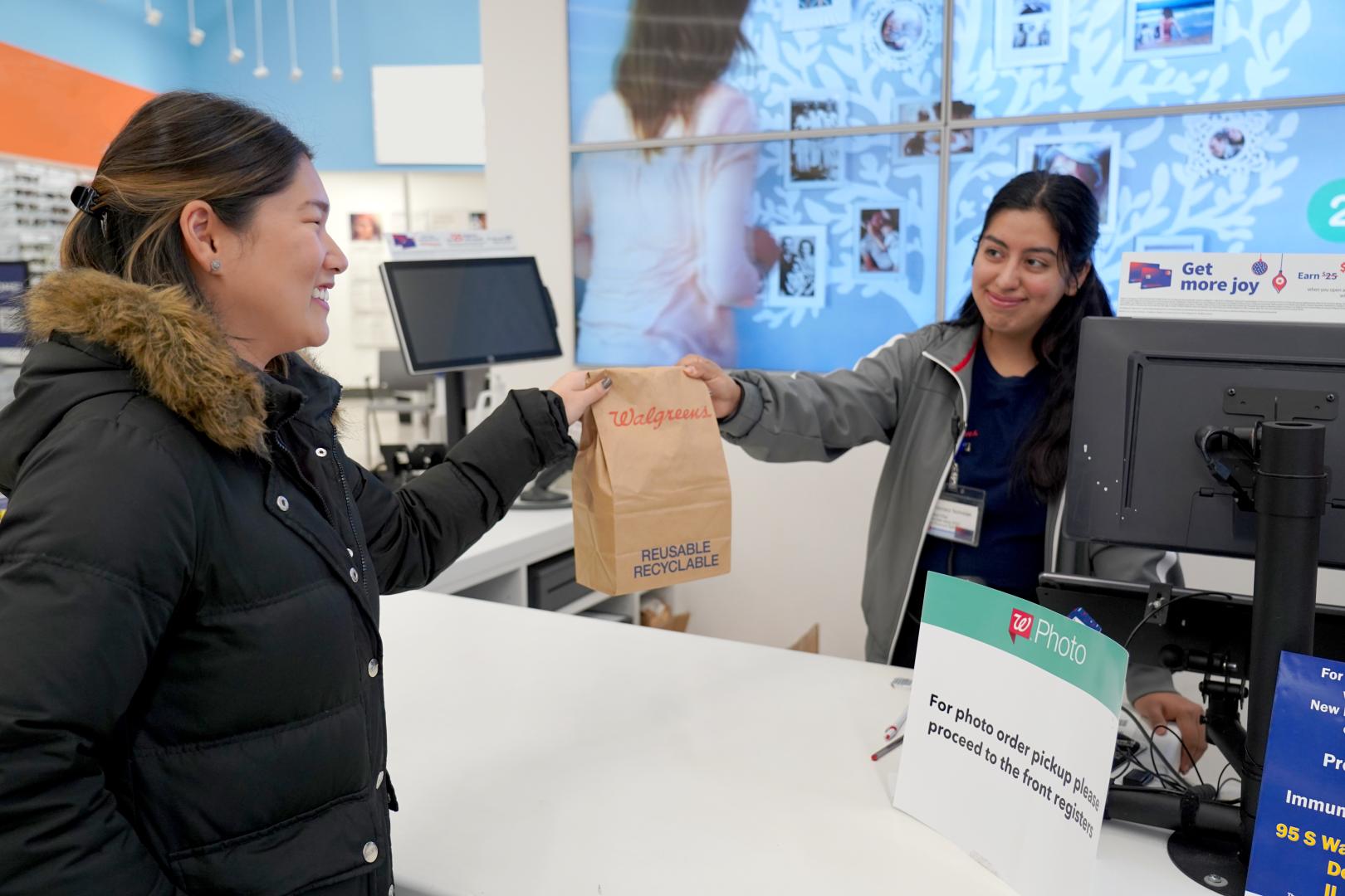 A courier picks up a 24-Hour Same Delivery order from Walgreens.