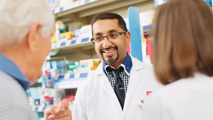 Walgreens Pharmacist with two Patients