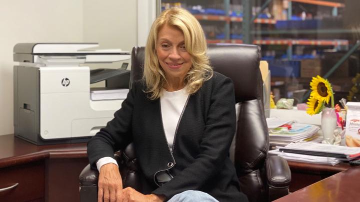 Natty Elias in her Healthtex office