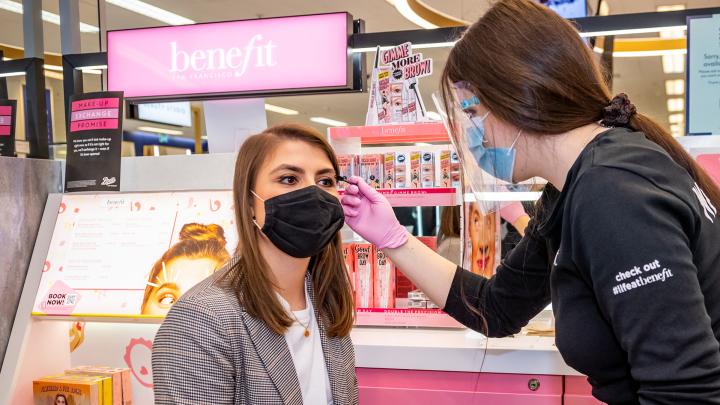 boots beauty consultant helps customer