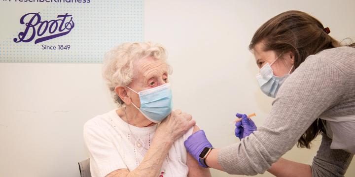 Lady receiving COVID vaccine