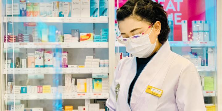 Boots Thailand pharmacist wearing PPE 
