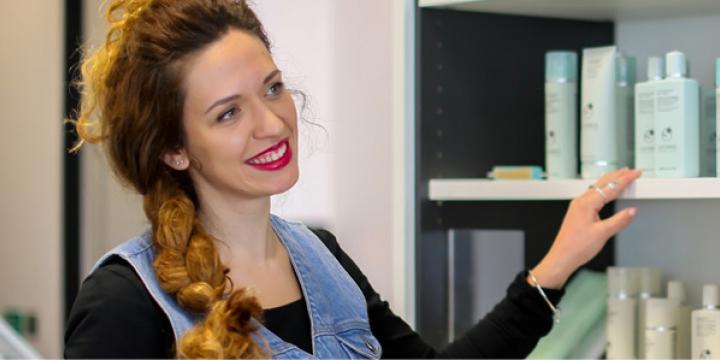 A lady in front of products