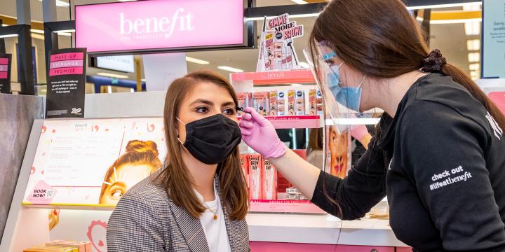 boots beauty consultant helps customer