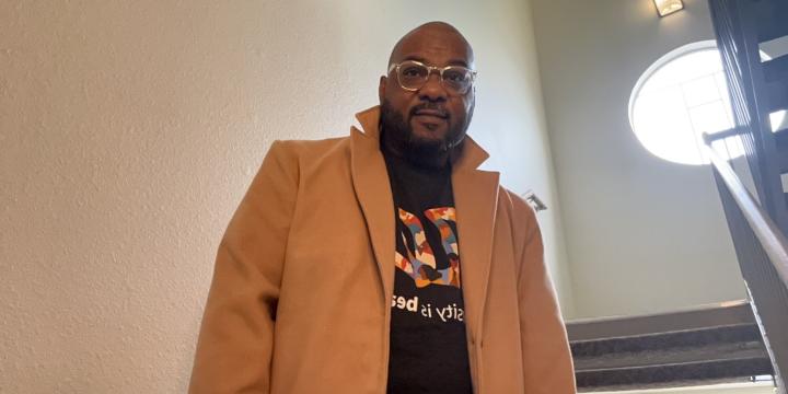 Dwight Washington, Jr. in DEI Walgreens sweatshirt