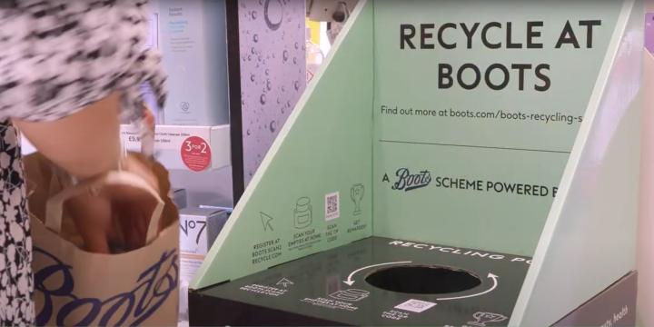 person donating products to bin