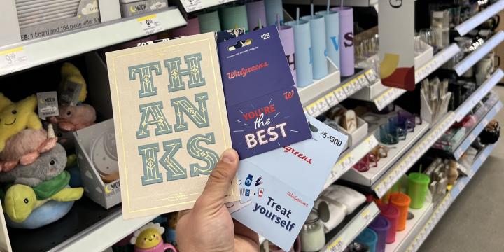 Thank You card and Gift Card in a customer's hand.