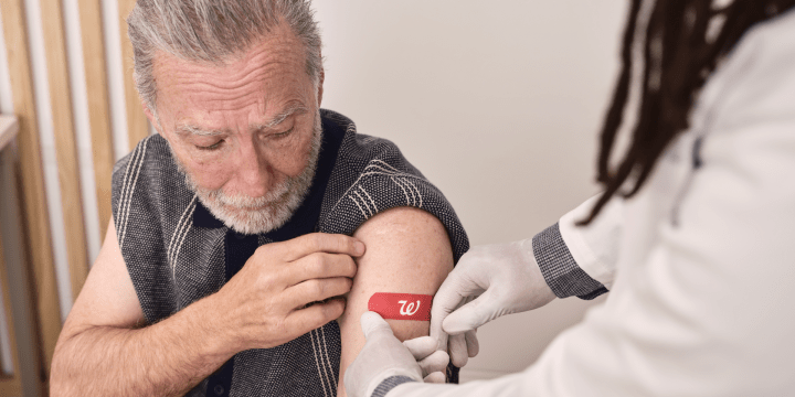 Pharmacist administers a vaccine