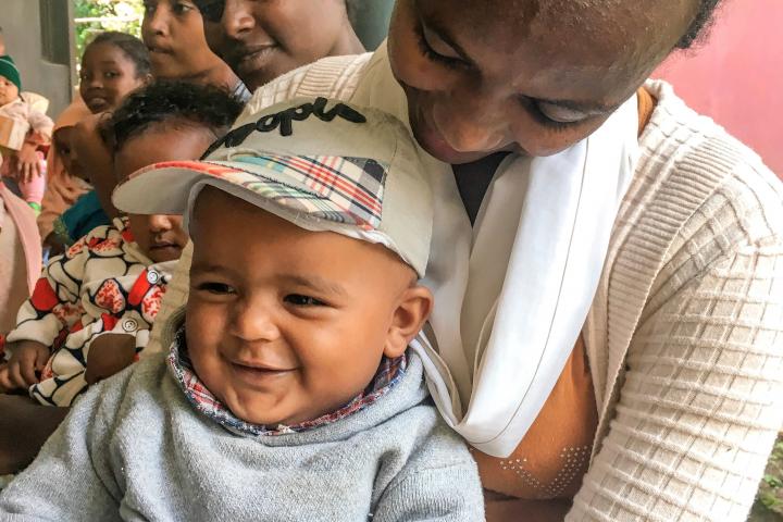 A baby and his mother smile outside a health clinic in Dire Dawa, Ethiopia.