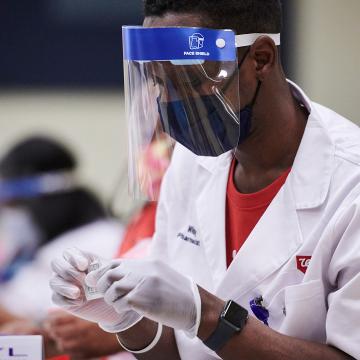Walgreens pharmacist administers vaccine