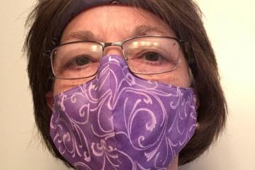 Woman wearing one of the face masks donated to health care workers