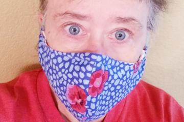 Woman wearing one of the face masks donated to health care workers